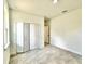 The bedroom features a tiled floor, baseboard trim and a double-door closet at 2645 Sw 155Th Ln, Ocala, FL 34473