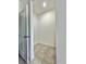 Walk-in closet featuring tile floor, white walls, and ample storage space at 2645 Sw 155Th Ln, Ocala, FL 34473