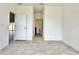 Tiled hallway with doors leading to other rooms including the bathroom at 2645 Sw 155Th Ln, Ocala, FL 34473