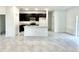 Contemporary kitchen with dark cabinets, granite countertops, and an island with a sink at 2645 Sw 155Th Ln, Ocala, FL 34473
