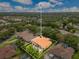 Aerial shot showcasing the backyard pool, patio, and lush greenery surrounding this property at 283 Lakay Pl, Longwood, FL 32779