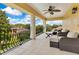 Covered balcony with outdoor seating and railing with decorative iron work offering lovely views at 283 Lakay Pl, Longwood, FL 32779