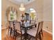 Formal dining room featuring wood floors, natural light, and a stunning chandelier at 283 Lakay Pl, Longwood, FL 32779