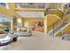 Spacious living area with staircase, open to kitchen, featuring neutral decor and bright natural light at 283 Lakay Pl, Longwood, FL 32779