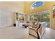 Comfortable living space with built-in shelving, a cozy sofa, and a view of the pool outside at 283 Lakay Pl, Longwood, FL 32779