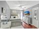 Bedroom features stylish decor, ceiling fan, TV, a modern bed, and a large dresser at 3038 Golden Rock Dr, Orlando, FL 32818