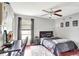 Bedroom featuring a ceiling fan, window, and a desk, providing a comfortable workspace at 3038 Golden Rock Dr, Orlando, FL 32818