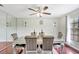 Elegant dining room with a modern table, plush chairs, and decorative lighting at 3038 Golden Rock Dr, Orlando, FL 32818