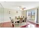 Dining room with wood floors, neutral paint, large window, and seating for six, perfect for Gathering meals at 3038 Golden Rock Dr, Orlando, FL 32818