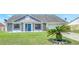 Charming single-Gathering home with stone accents, well-maintained lawn, and blue front door at 3038 Golden Rock Dr, Orlando, FL 32818