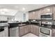 Kitchen featuring stainless steel appliances and stylish countertop at 3038 Golden Rock Dr, Orlando, FL 32818