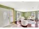Bright living room with hardwood floors and ample natural light from large windows at 3038 Golden Rock Dr, Orlando, FL 32818