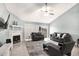 Cozy living room featuring a fireplace, tile flooring, sliding glass doors to the backyard, and comfortable furniture at 3038 Golden Rock Dr, Orlando, FL 32818