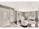 Bright living room featuring hardwood floors, neutral walls, large windows, and modern furnishings at 3038 Golden Rock Dr, Orlando, FL 32818