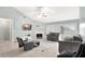 Cozy living room with a fireplace, ceiling fan, and sliding glass doors at 3038 Golden Rock Dr, Orlando, FL 32818