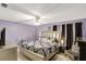 Spacious main bedroom with stylish furnishings and elegant fan at 3038 Golden Rock Dr, Orlando, FL 32818
