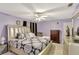 Spacious main bedroom with stylish furnishings, elegant fan, and ample natural light at 3038 Golden Rock Dr, Orlando, FL 32818