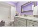 Lilac-toned bathroom features bathtub shower combo, new vanity and quartz countertop at 316 Dornoch Ct, Winter Springs, FL 32708