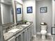 Beautiful bathroom with double sinks, granite countertops, and modern fixtures at 316 Dornoch Ct, Winter Springs, FL 32708
