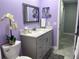 Updated bathroom features a vanity with solid surface countertop, toilet, and framed mirrors at 316 Dornoch Ct, Winter Springs, FL 32708