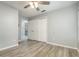 Bright bedroom featuring wood floors, a ceiling fan, closet, and neutral paint at 316 Dornoch Ct, Winter Springs, FL 32708