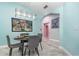 Cozy dining room with a modern light fixture, artwork, and seating for four guests at 316 Dornoch Ct, Winter Springs, FL 32708