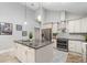 Modern kitchen featuring a granite island, stainless steel appliances, and stylish cabinetry at 316 Dornoch Ct, Winter Springs, FL 32708