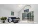 Bright living room with vaulted ceiling, fan and sliding doors leading to the enclosed lanai at 316 Dornoch Ct, Winter Springs, FL 32708