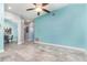 Spacious living room featuring stylish tile floors, cool-toned walls, and an open layout at 316 Dornoch Ct, Winter Springs, FL 32708