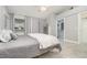 Bedroom featuring tile flooring, and view into the en-suite bathroom and walk-in closet at 316 Dornoch Ct, Winter Springs, FL 32708