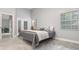 Neutral-toned bedroom features tile flooring, ceiling fan, with access to outside patio at 316 Dornoch Ct, Winter Springs, FL 32708