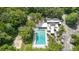 Aerial view of community pool with lounge chairs and ample space at 316 Dornoch Ct, Winter Springs, FL 32708
