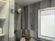 Modern shower with gray tiling, glass door, and contemporary fixtures at 316 Dornoch Ct, Winter Springs, FL 32708