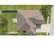 An aerial view of the house featuring a manicured lawn, a patio, a driveway, and a well maintained roof at 3551 Statham Dr, Apopka, FL 32712