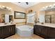 Bathroom featuring a tub, double vanity, decorative lighting, and tiled floors at 3551 Statham Dr, Apopka, FL 32712