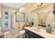 Bathroom featuring a glass door shower, an oversized mirror and decorative elements at 3551 Statham Dr, Apopka, FL 32712