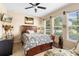 Inviting bedroom with natural light, ceiling fan, and comfortable furnishings at 3551 Statham Dr, Apopka, FL 32712