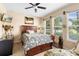 Comfortable bedroom with natural light, ceiling fan and stylish decor at 3551 Statham Dr, Apopka, FL 32712