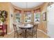 Cozy breakfast nook with tile floors and an abundance of natural light at 3551 Statham Dr, Apopka, FL 32712