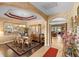 Dining room with wooden table and chairs, a china cabinet, a chandelier and decorative ceilings at 3551 Statham Dr, Apopka, FL 32712