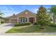 Charming single-story home featuring a well-manicured lawn and inviting front porch at 3551 Statham Dr, Apopka, FL 32712