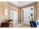 Bright entryway with tile flooring, a white front door, and a view of the outside at 3551 Statham Dr, Apopka, FL 32712
