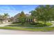 Charming home with a meticulously landscaped yard, lush lawn, mature trees and a welcoming curb appeal at 3551 Statham Dr, Apopka, FL 32712