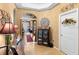 Inviting hallway with decorative accents, neutral walls, and access to laundry room at 3551 Statham Dr, Apopka, FL 32712