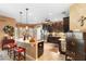 Open kitchen with granite counters, a central island, and stainless steel appliances at 3551 Statham Dr, Apopka, FL 32712