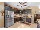 Modern kitchen features stainless steel appliances and dark wood cabinetry at 3551 Statham Dr, Apopka, FL 32712