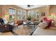 Bright living room with multiple windows, neutral decor, and an open layout for entertaining at 3551 Statham Dr, Apopka, FL 32712