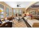 Comfortable living room boasts natural light and an open layout to the adjacent dining area at 3551 Statham Dr, Apopka, FL 32712