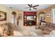 Spacious living room features comfortable seating and a decorative fireplace at 3551 Statham Dr, Apopka, FL 32712