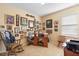 Home office with a desk and chair setup and plenty of wall decor at 3551 Statham Dr, Apopka, FL 32712